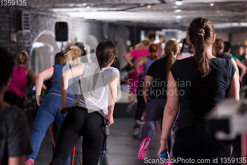 Image of sporty women exercising with a rubber bands