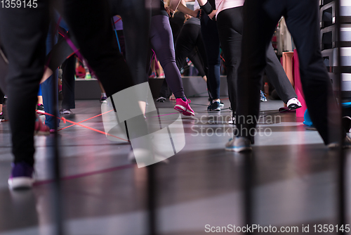 Image of sporty women exercising with a rubber bands