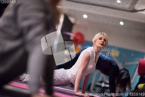 Image of sporty women doing aerobics exercises