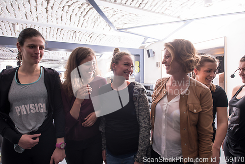 Image of portrait of a group sporty women with pregnant friend