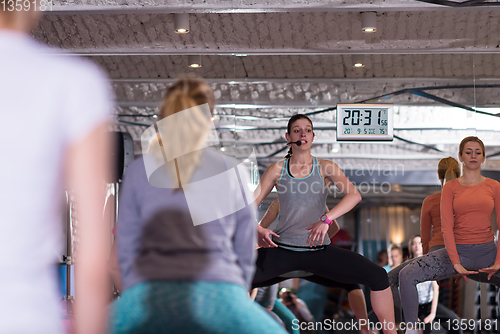 Image of sporty women doing aerobics exercises