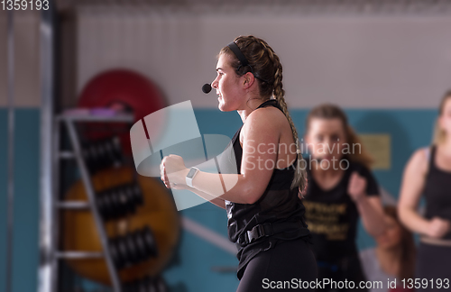 Image of sporty women doing aerobics exercises