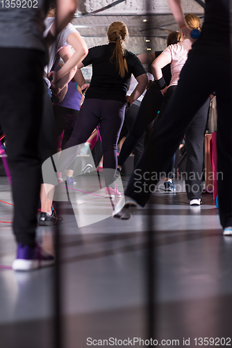 Image of sporty women exercising with a rubber bands