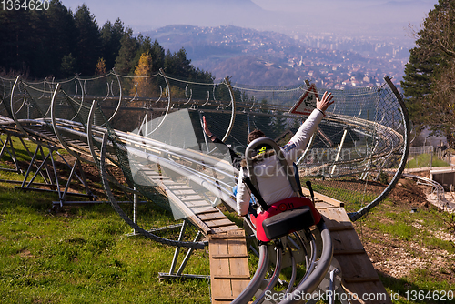 Image of couple driving on alpine coaster