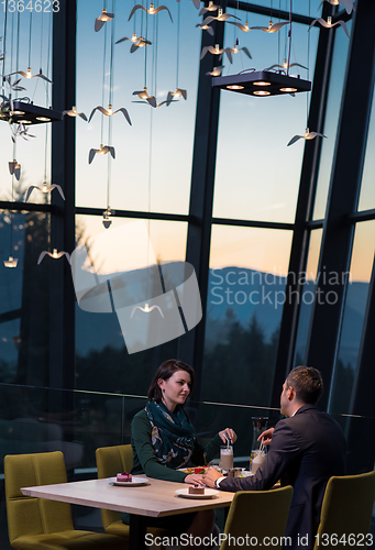 Image of loving couple enjoying romantic dinner