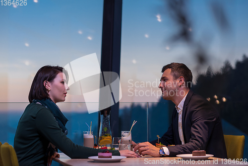Image of loving couple enjoying romantic dinner