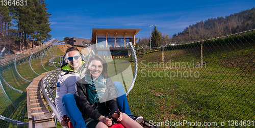 Image of couple driving on alpine coaster