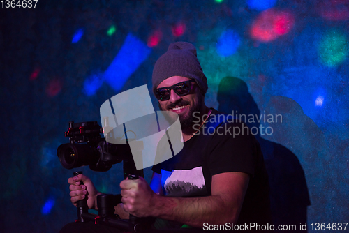 Image of videographer in neon disco party