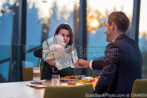 Image of loving couple enjoying romantic dinner