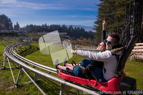 Image of couple driving on alpine coaster