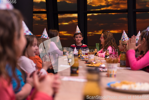 Image of young boy having birthday party