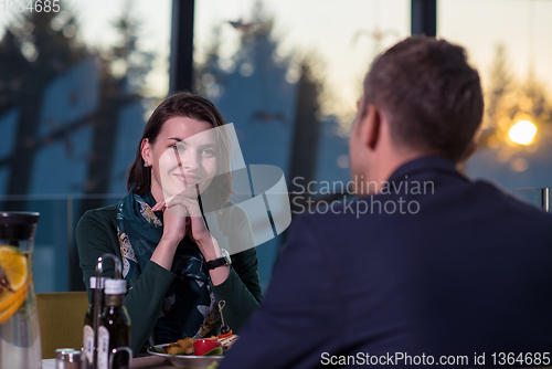 Image of loving couple enjoying romantic dinner