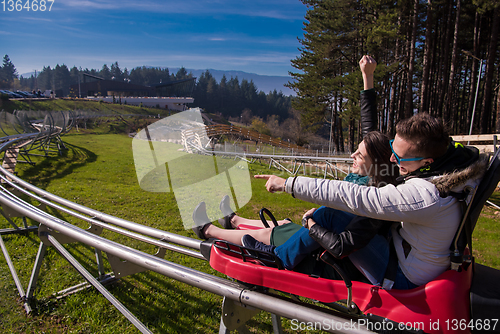 Image of couple driving on alpine coaster