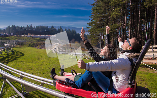 Image of couple driving on alpine coaster