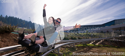 Image of couple driving on alpine coaster