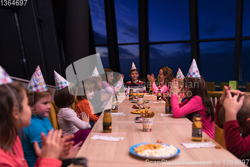 Image of young boy having birthday party