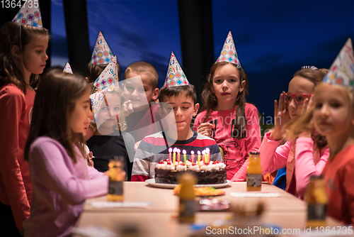 Image of young boy having birthday party