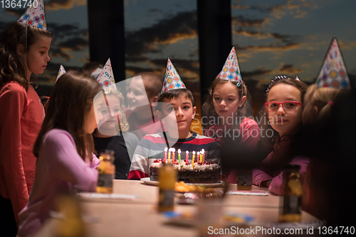 Image of young boy having birthday party