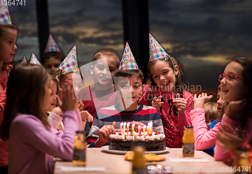 Image of young boy having birthday party
