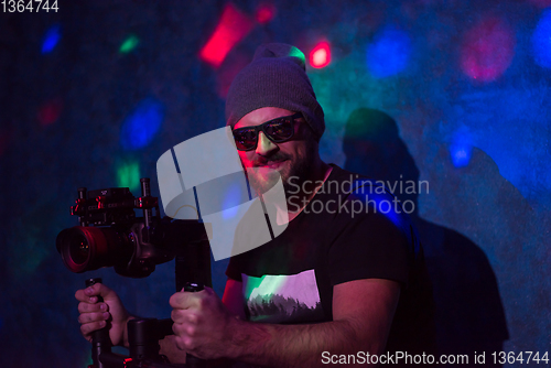 Image of videographer in neon disco party