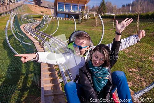 Image of couple driving on alpine coaster