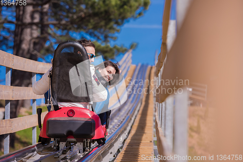 Image of couple driving on alpine coaster