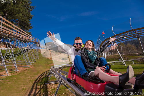 Image of couple driving on alpine coaster