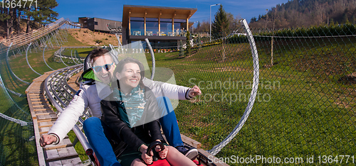 Image of couple driving on alpine coaster