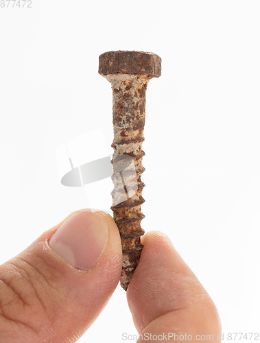 Image of Rusted old screw isolated