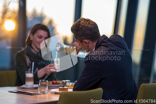 Image of loving couple enjoying romantic dinner