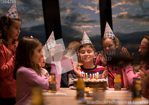 Image of young boy having birthday party