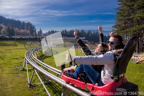 Image of couple driving on alpine coaster