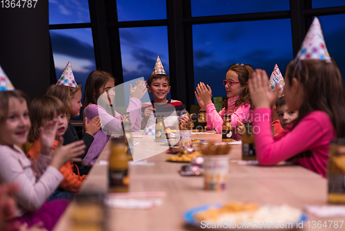 Image of young boy having birthday party