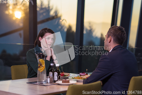 Image of loving couple enjoying romantic dinner