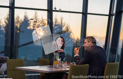 Image of loving couple enjoying romantic dinner