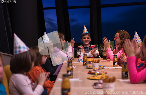 Image of young boy having birthday party