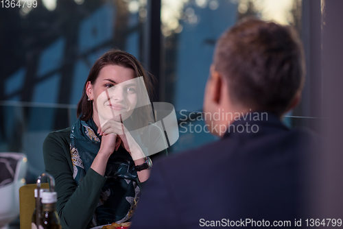 Image of loving couple enjoying romantic dinner