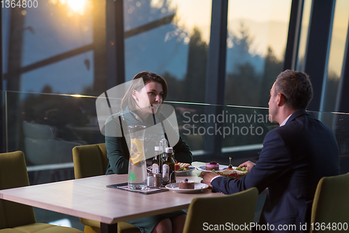 Image of loving couple enjoying romantic dinner