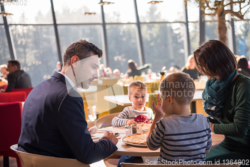 Image of happy family enjoying lunch time together