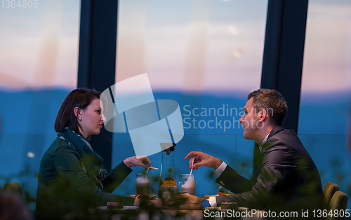 Image of loving couple enjoying romantic dinner