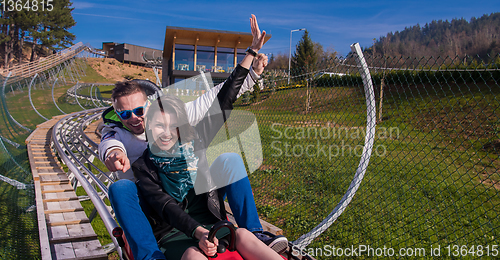 Image of couple driving on alpine coaster