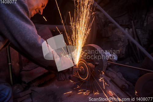 Image of the blacksmith polishing metal products