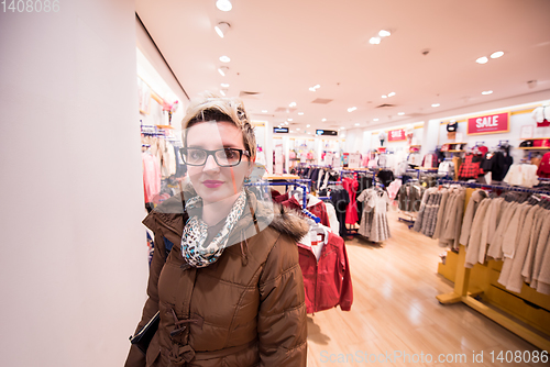 Image of portrait of young woman in clothing store