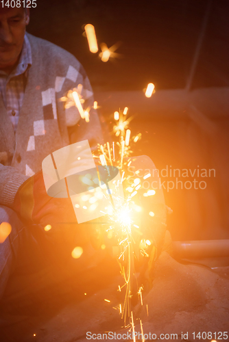 Image of the blacksmith polishing metal products