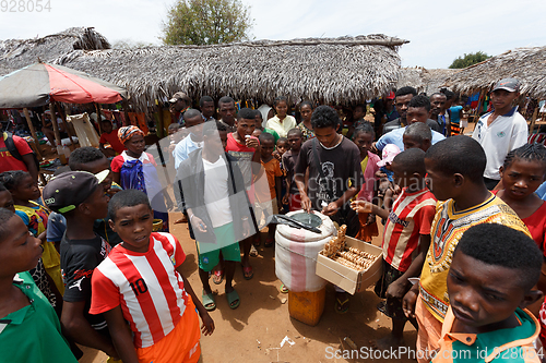 Image of Man sell ice cream on rural Madagascar marketplace