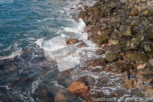 Image of beautiful wild beach with black sand