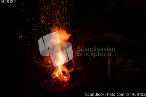 Image of Traditional blacksmith furnace with burning fire