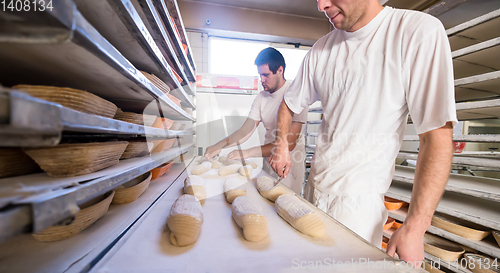 Image of bakers preparing the dough