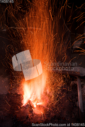 Image of Traditional blacksmith furnace with burning fire