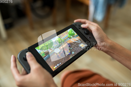 Image of Hong Kong, 16 May 2017 -:Woman playing Nintendo Switch at home